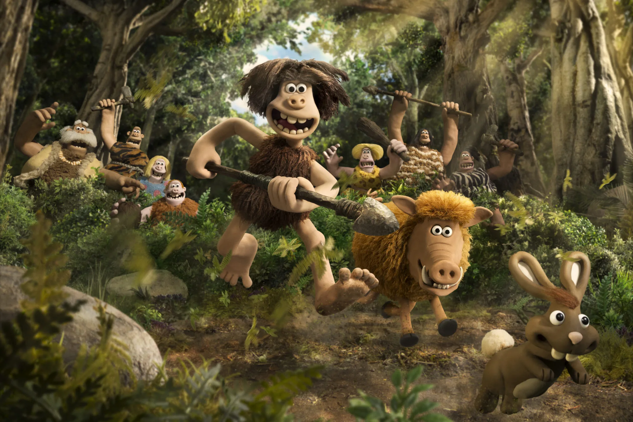 Early Man characters and prehistoric animals in a forest