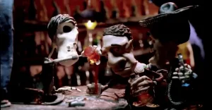 Skeleton characters gathered around a table in René Castillo's Down to the Bone