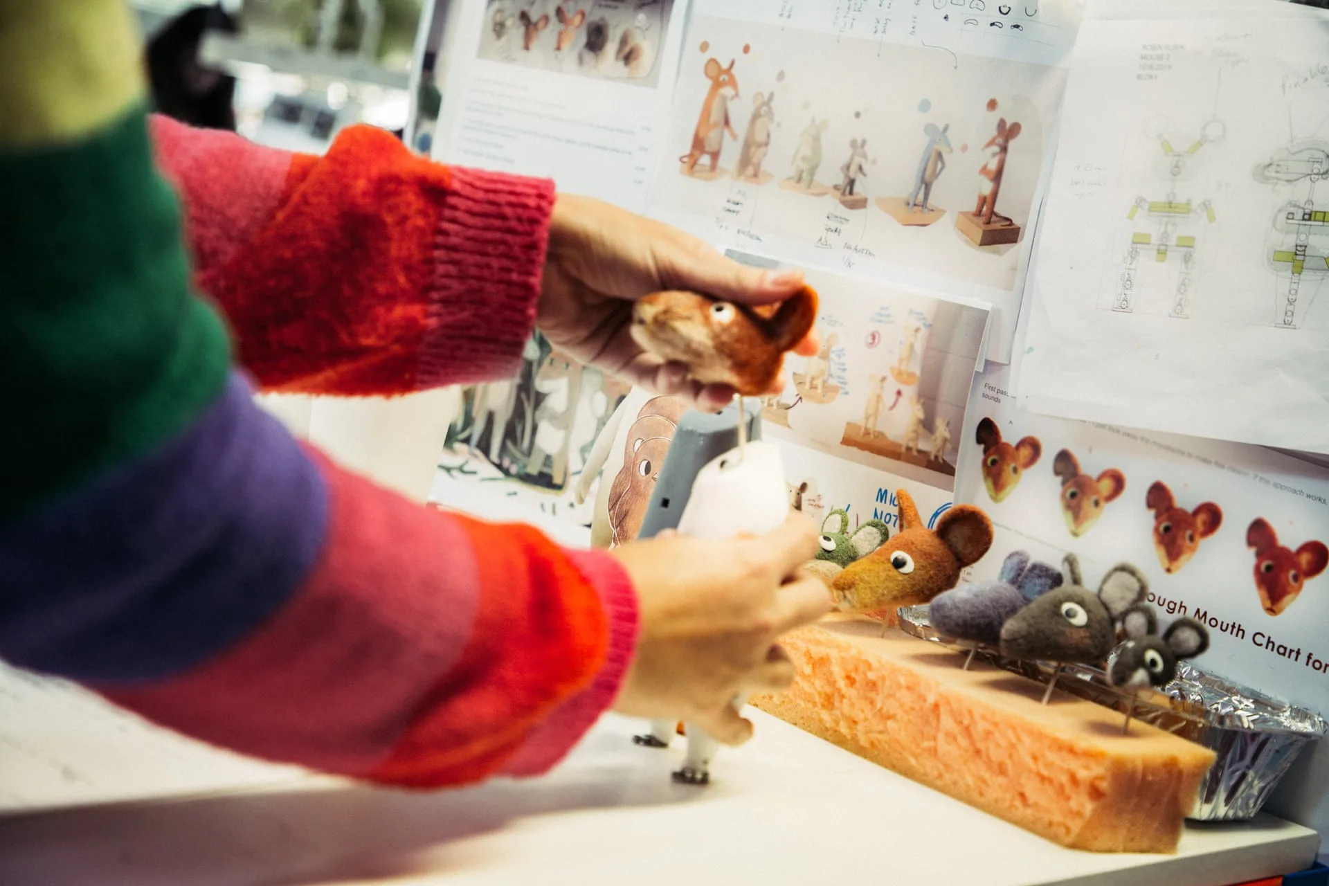 Aardman artist assembling miniature Robin Robin characters